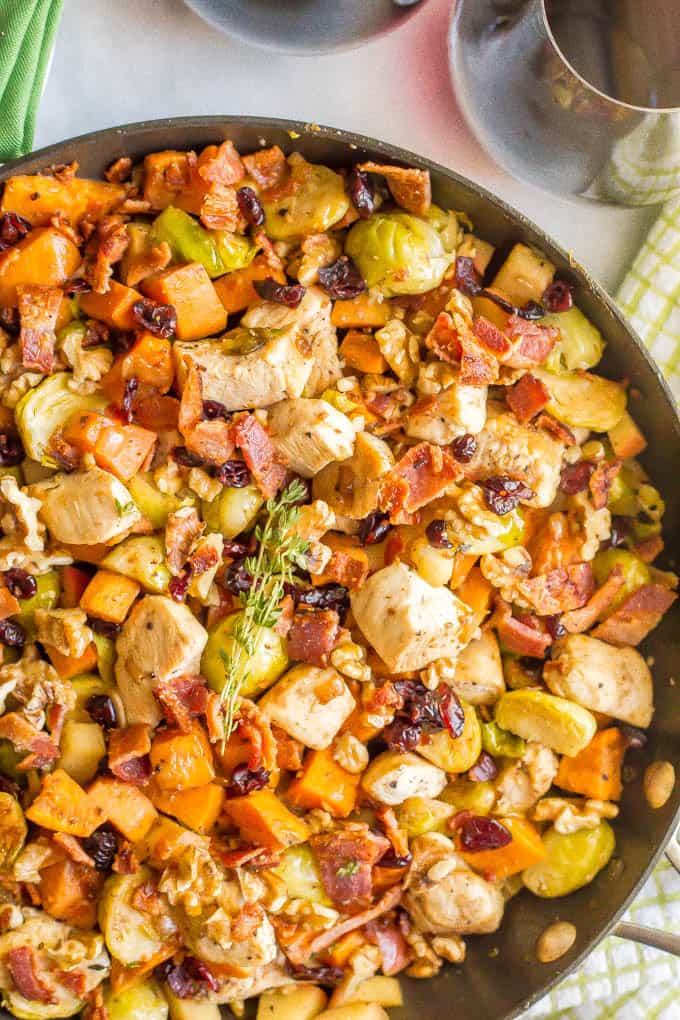 One-pot easy harvest chicken skillet with sweet potatoes and Brussels sprouts is a beautiful and delicious recipe that’s perfect for a fall dinner! #onepot #chicken #easydinner | www.familyfoodonthetable