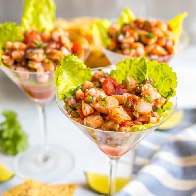 Easy shrimp martini salsa appetizer served up in glasses with lettuce underneath