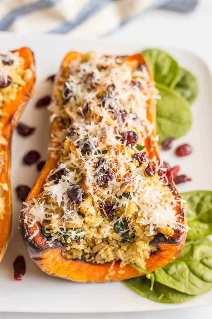 These stuffed butternut squash with quinoa, mushrooms and spinach are a gluten-free and vegetarian dish that’s hearty and filling and full of flavor! #stuffedsquash #butternutsquash #vegetarian #glutenfreerecipes | www.familyfoodonthetable.com