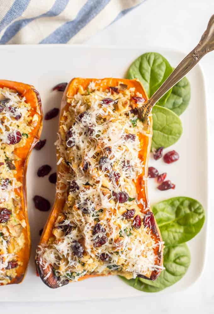 These stuffed butternut squash with quinoa, mushrooms and spinach are a gluten-free and vegetarian dish that’s hearty and filling and full of flavor! #stuffedsquash #butternutsquash #vegetarian #glutenfreerecipes 