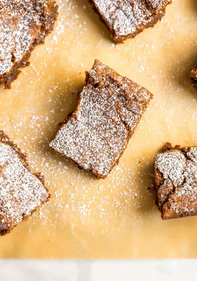 Whole wheat gingerbread cookie bars are soft and chewy and full of warm spices. They are perfect for holiday parties, bake sales and cookie exchanges! #holidaybaking #Christmas #gingerbread | www.familyfoodonthetable.com