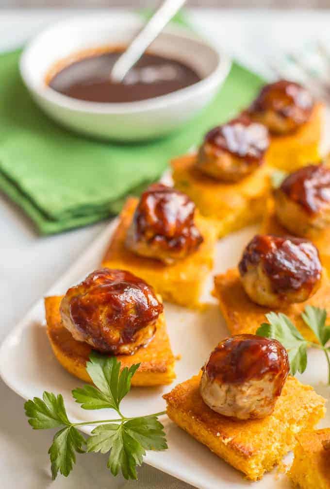 Chicken meatballs and cornbread appetizer with BBQ sauce is a fun, flavorful twist on party food that’s perfect for game day and entertaining! #meatballs #gameday #easyappetizers #southernfood | www.familyfoodonthetable.com