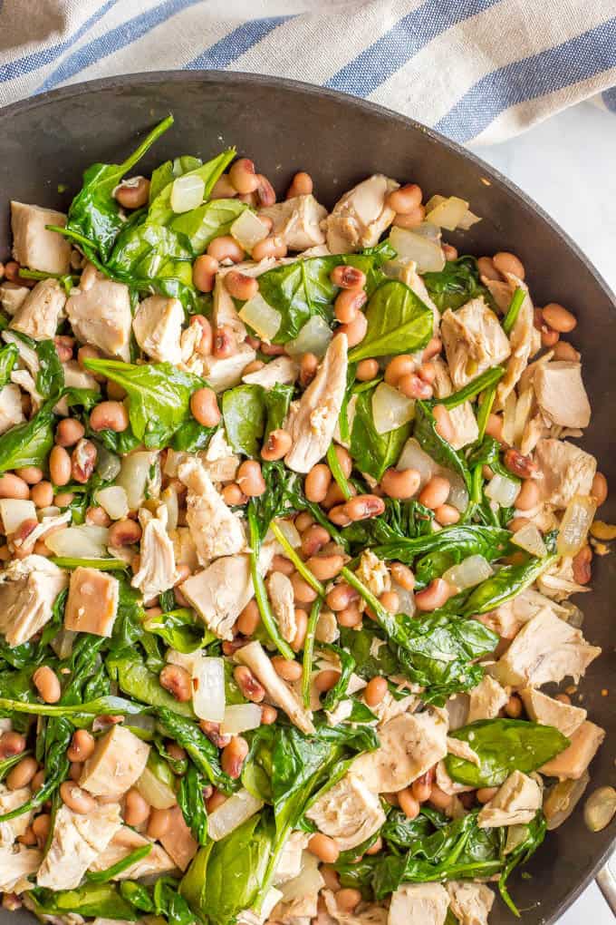 One-pot low-carb leftover chicken recipe with spinach and beans is just 5 ingredients and 15 minutes and perfect for an easy weeknight dinner! #onepotmeals #easychickendinner #lowcarbdinner