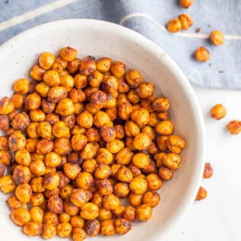BBQ roasted chickpeas are crunchy, slightly spicy and totally addictive! They are great for a healthy, high-protein snack or to add some crunch to salads and wraps and dips. (Vegan, gluten-free) #chickpeas #healthysnack #vegan | www.familyfoodonthetable.com