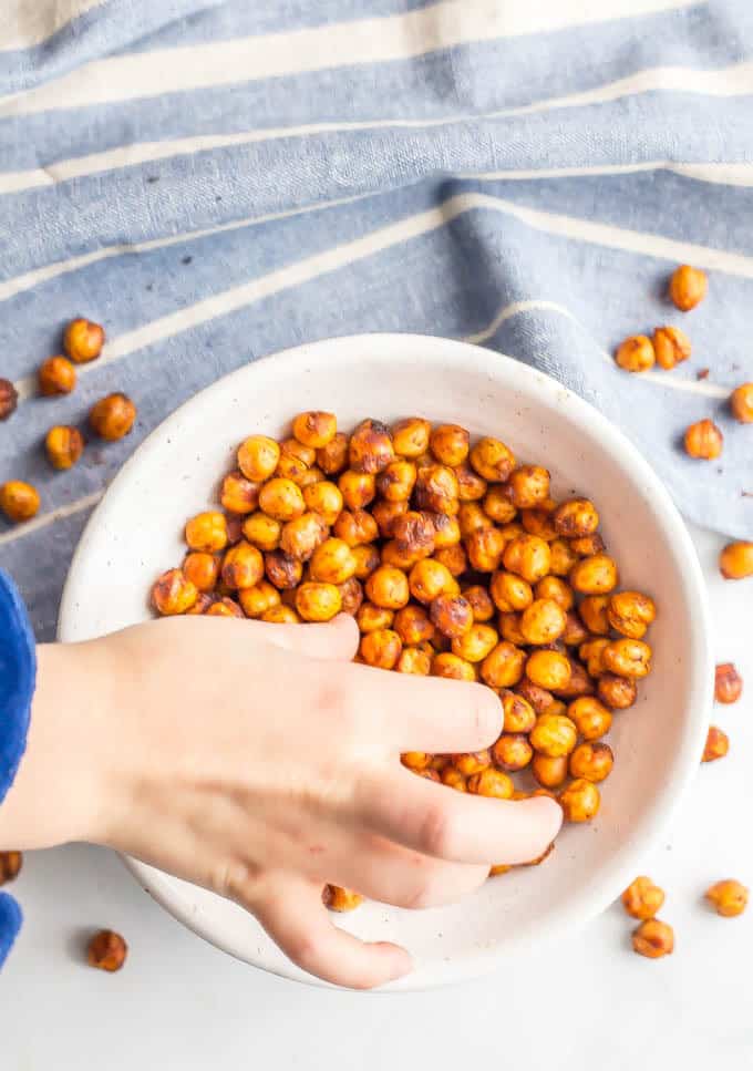 BBQ roasted chickpeas are crunchy, slightly spicy and totally addictive! They are great for a healthy, high-protein snack or to add some crunch to salads and wraps and dips. (Vegan, gluten-free) #chickpeas #healthysnack #vegan | www.familyfoodonthetable.com