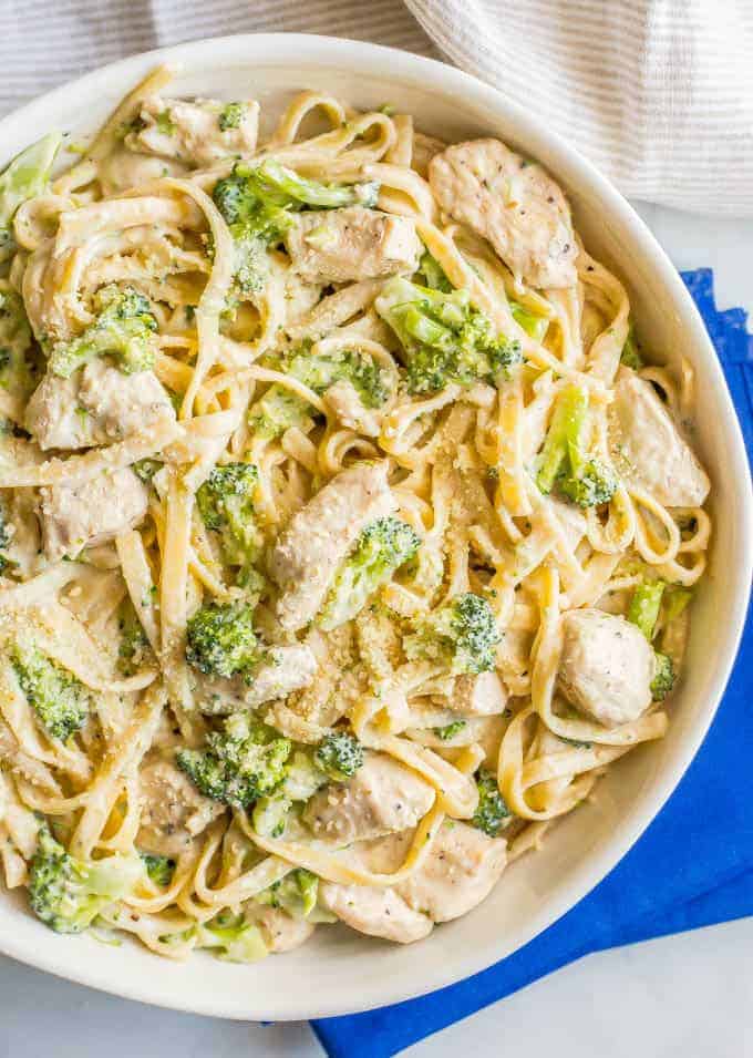 Healthy chicken Alfredo with broccoli is a quick and easy dinner with a lightened up but delicious creamy sauce coating every bite. Sure to be a new family favorite recipe! #easychickenrecipe #chickendinner #chickenpasta | www.familyfoodonthetable.com