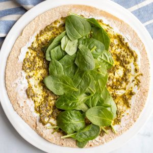 Whole wheat wrap with goat cheese, pesto and spinach