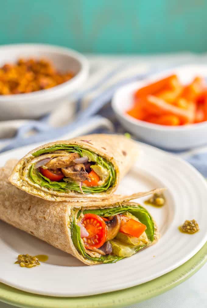 This roasted veggie wrap with pesto and goat cheese is the ultimate in lunchtime satisfaction! This vegetarian wrap can be prepped ahead and reheated and can also be customized to include your favorite vegetables! #veggiewrap #veggielunch #healthylunch | www.familyfoodonthetable.com