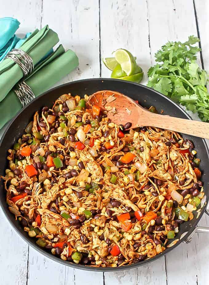 This quick and easy Southwest chicken skillet dinner uses rotisserie chicken, fresh veggies, canned beans and simple spices for a delicious meal that’s ready in just 15 minutes! #easychickendinner #onepotrecipe | www.familyfoodonthetable.com