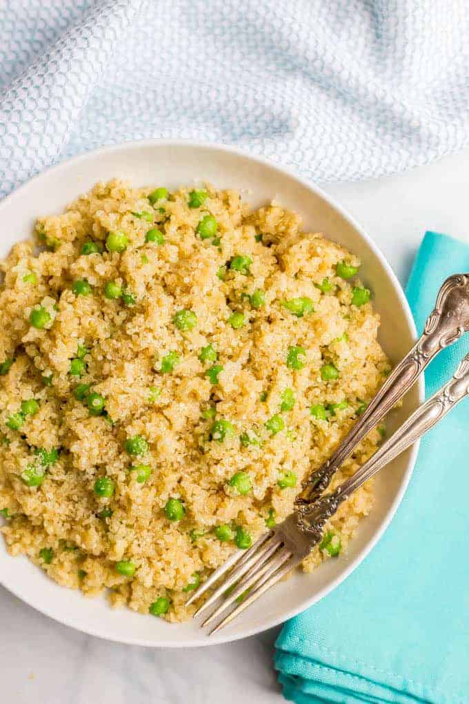 This easy, one-pot quinoa with peas and Parmesan cheese is a simple side dish with big flavors! It’s perfect for a quick dinner side to pair with your favorite chicken or pork recipe. #quinoarecipes #frozenpeas #easysidedish | www.familyfoodonthetable.com