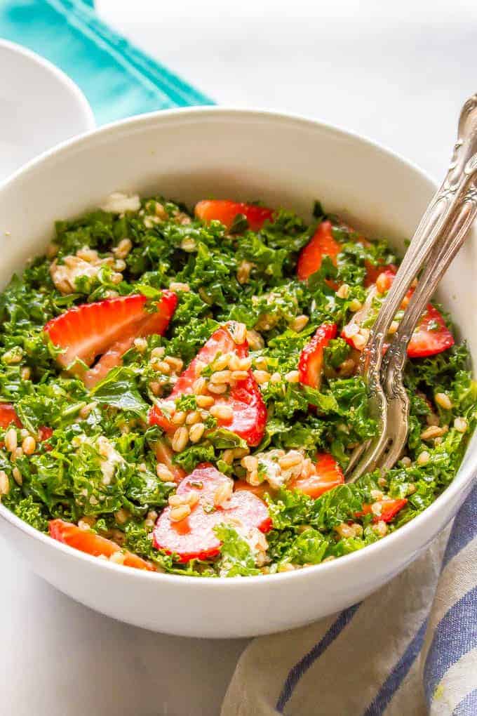 Farro, kale and strawberry salad with goat cheese is a delicious combination with bright, fresh flavors and tons of great texture. It’s perfect for a light lunch or as a side salad with dinner. #farrosalad #kalesalad #veggiesalad #healthysalad
