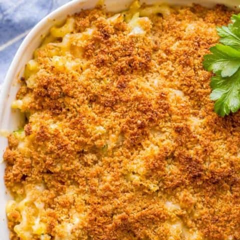 Close-up overhead shot of baked healthy chicken broccoli mac and cheese with a buttery breadcrumb topping