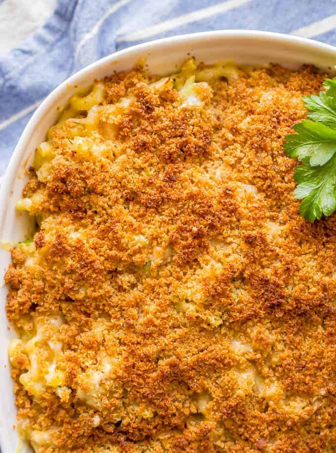 Close-up overhead shot of baked healthy chicken broccoli mac and cheese with a buttery breadcrumb topping