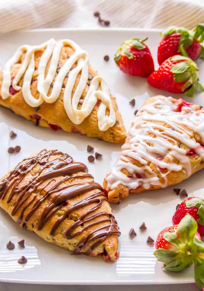 These healthy strawberry scones are whole wheat, naturally sweetened, low in fat and perfect for breakfast or brunch! You can add in some optional mini chocolate chips and/or serve with any of my glaze topping ideas for an extra special treat! #strawberryrecipes #scones #brunchrecipes | www.familyfoodonthetable.com