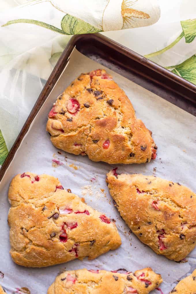 Healthy strawberry scones on a baking sheet after coming out of the oven