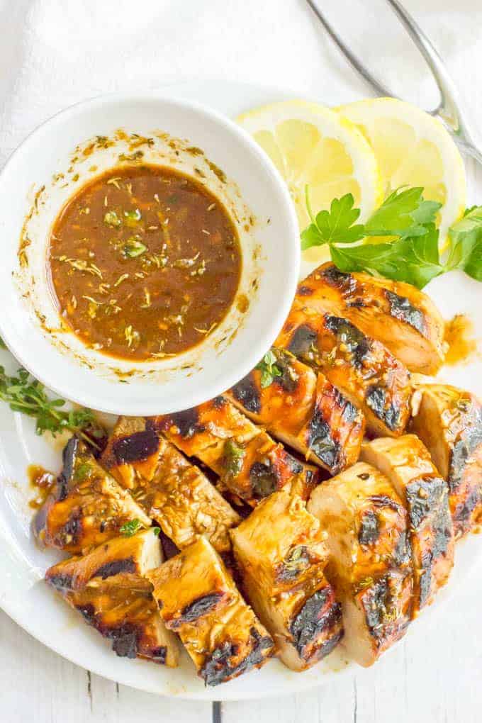 Balsamic herb grilled chicken marinade is tangy, herby and bright and perfect for a quick and easy marinade to give delicious flavor to your grilled chicken rotation. #grilledchicken #chickenmarinade | www.familyfoodonthetable.com