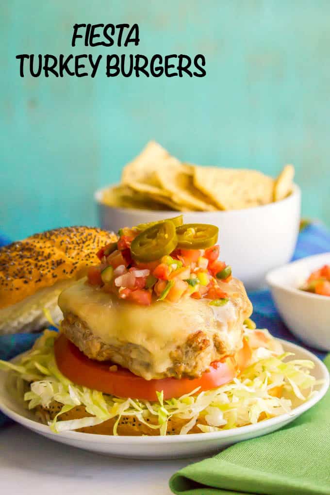 Fiesta turkey burgers have just 4 basic ingredients but create a little flavor explosion in your mouth! Add your favorite taco toppings and dig into these juicy, fun and delicious burgers! | www.familyfoodonthetable.com