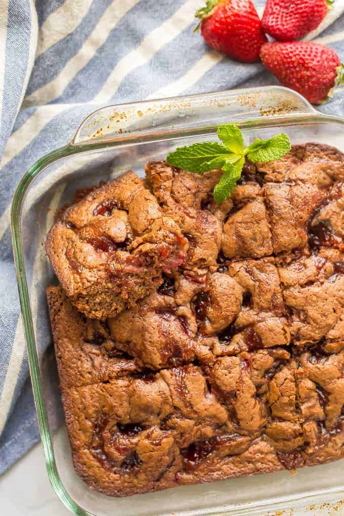 Whole wheat healthy strawberry brownies are soft on the inside, chewy on the outside and full of delicious chocolate and strawberry flavors, making them perfect for a homemade sweet treat! #strawberrydessert #brownies #healthydessert | www.familyfoodonthetable.com