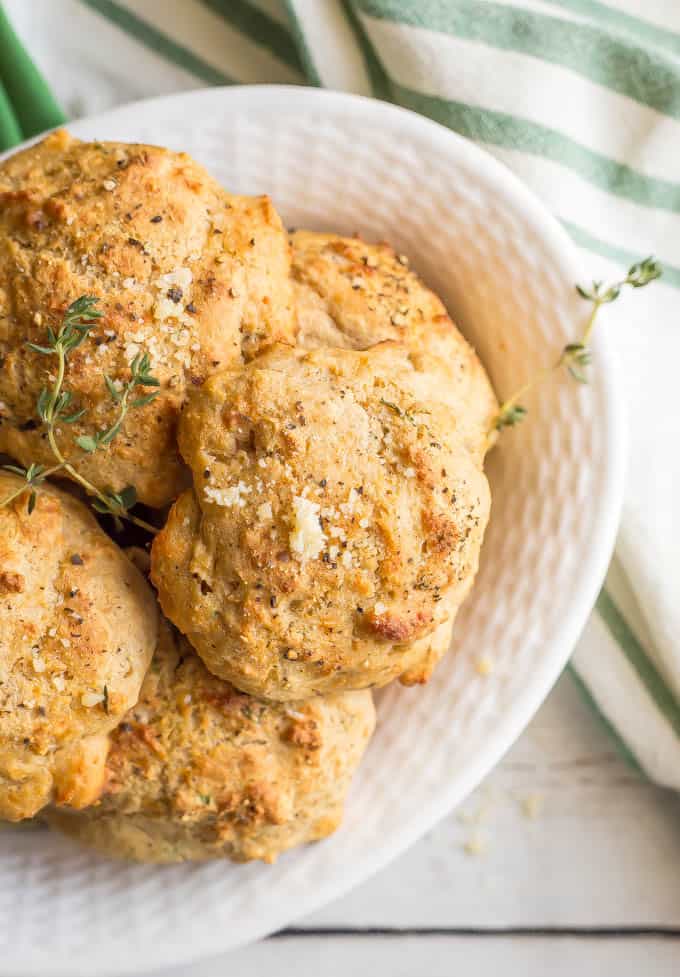 Close up of Parmesan herb drop biscuits in a white bowl