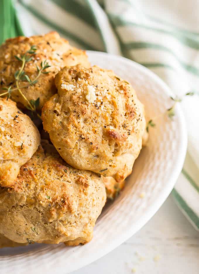 Close up of Parmesan herb drop biscuits in a white bowl