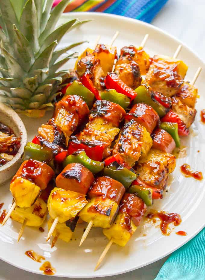 Teriyaki chicken pineapple kabobs are a fun and flavorful recipe for the grill (or oven) with tender chicken, peppers, fresh sweet pineapple and an easy teriyaki sauce that doubles as a marinade and sauce for basting and serving. Perfect for a family dinner or a BBQ party! | www.familyfoodonthetable.com