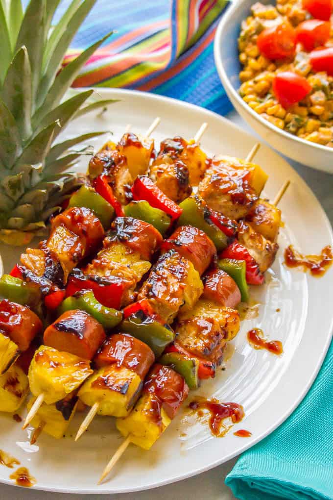 Teriyaki chicken pineapple kabobs are a fun and flavorful recipe for the grill (or oven) with tender chicken, peppers, fresh sweet pineapple and an easy teriyaki sauce that doubles as a marinade and sauce for basting and serving. Perfect for a family dinner or a BBQ party! | www.familyfoodonthetable.com