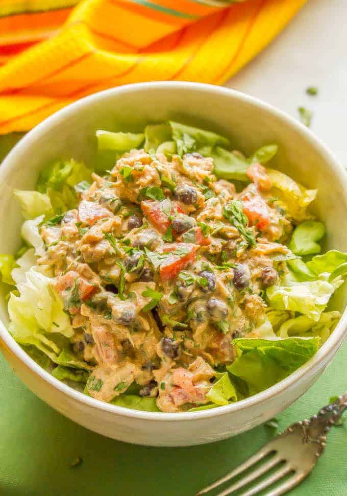 Southwest tuna salad with black beans, tomato and cilantro is a great healthy lunch recipe with tons of protein and southwestern spices. It takes just 10 minutes to make and can be served as a sandwich, wrap or lettuce wrap, as a salad, or stuffed in an avocado or tomato. #tunasalad #tunarecipe #healthylunch | www.familyfoodonthetable.com