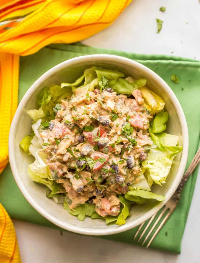 Southwest tuna salad with black beans, tomato and cilantro is a great healthy lunch recipe with tons of protein and southwestern spices. It takes just 10 minutes to make and can be served as a sandwich, wrap or lettuce wrap, as a salad, or stuffed in an avocado or tomato. #tunasalad #tunarecipe #healthylunch | www.familyfoodonthetable.com