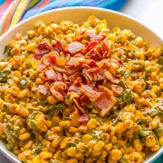 Summer corn salad with roasted poblanos, cilantro and a creamy dressing is a fresh and flavorful veggie side dish. It’s great served in individual cups for a portable and fun BBQ recipe everyone will love! #corn #cornsalad #bbqrecipes | www.familyfoodonthetable.com
