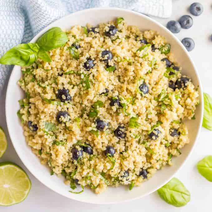 Blueberry basil quinoa salad with honey lime vinaigrette served in a bowl