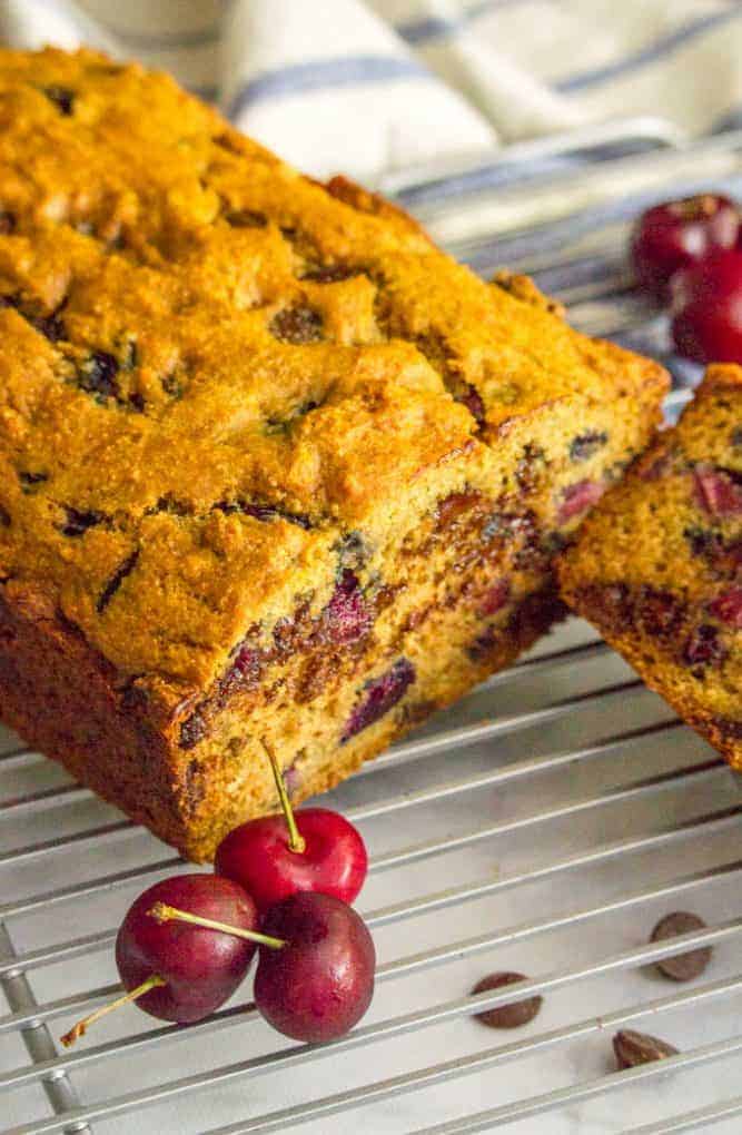 This naturally sweetened and whole wheat cherry chocolate chip bread is perfect for a healthier breakfast or snack and a great way to use fresh cherries in the summer! #cherries #chocolate #quickbread #breakfast #baking