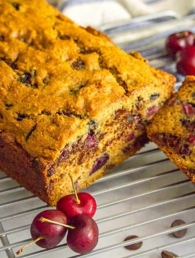 This naturally sweetened and whole wheat cherry chocolate chip bread is perfect for a healthier breakfast or snack and a great way to use fresh cherries in the summer! #cherries #chocolate #quickbread #breakfast #baking