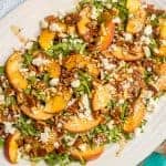 Arugula salad with peaches, pecans and goat cheese