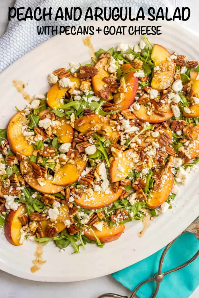 Arugula salad with peaches, pecans and goat cheese with balsamic vinaigrette is perfect for an easy, light and delicious summer side salad! #arugulasalad #peachrecipes #summersalad #saladrecipes #lowcarbrecipes #glutenfreerecipes