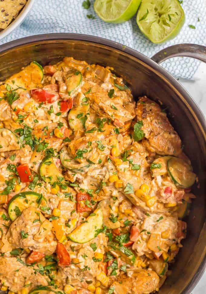 Queso chicken skillet with vegetables is an easy, cheesy, delicious one-pot dinner the whole family will enjoy! Great with rice, tortillas or chips! #quesochicken #chickendinner #easychickenrecipes #familydinner #chickenrecipes