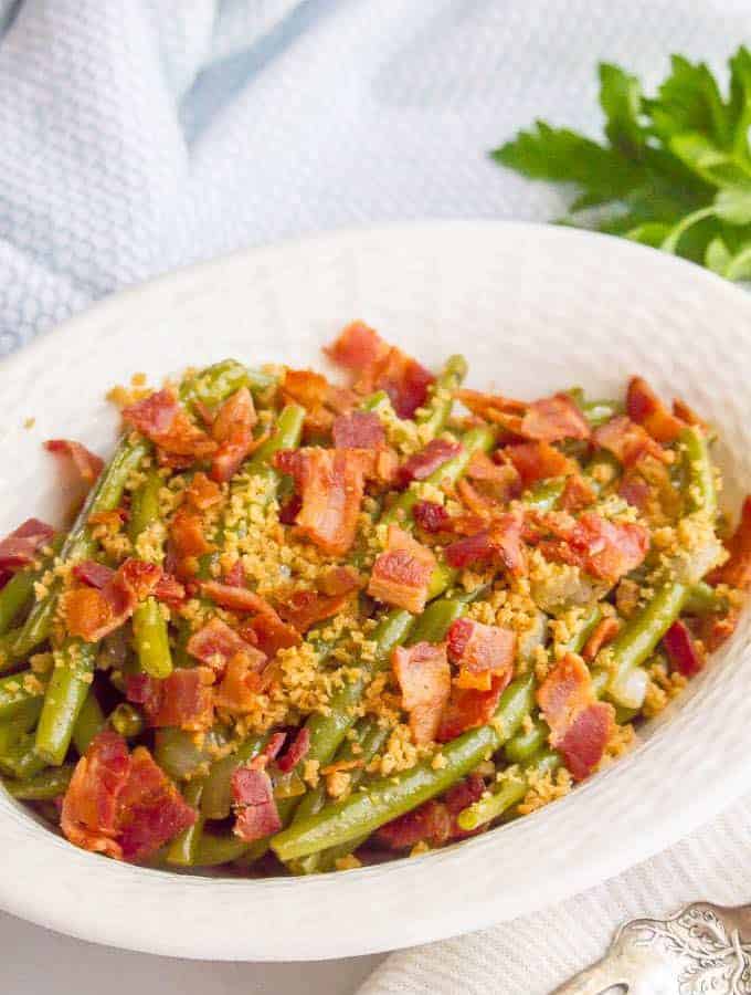 Green beans with bacon and buttery breadcrumbs are just 5 ingredients but packed with so much flavor for a delicious, easy side dish! #greenbeans #sidedish #veggies #veggieside