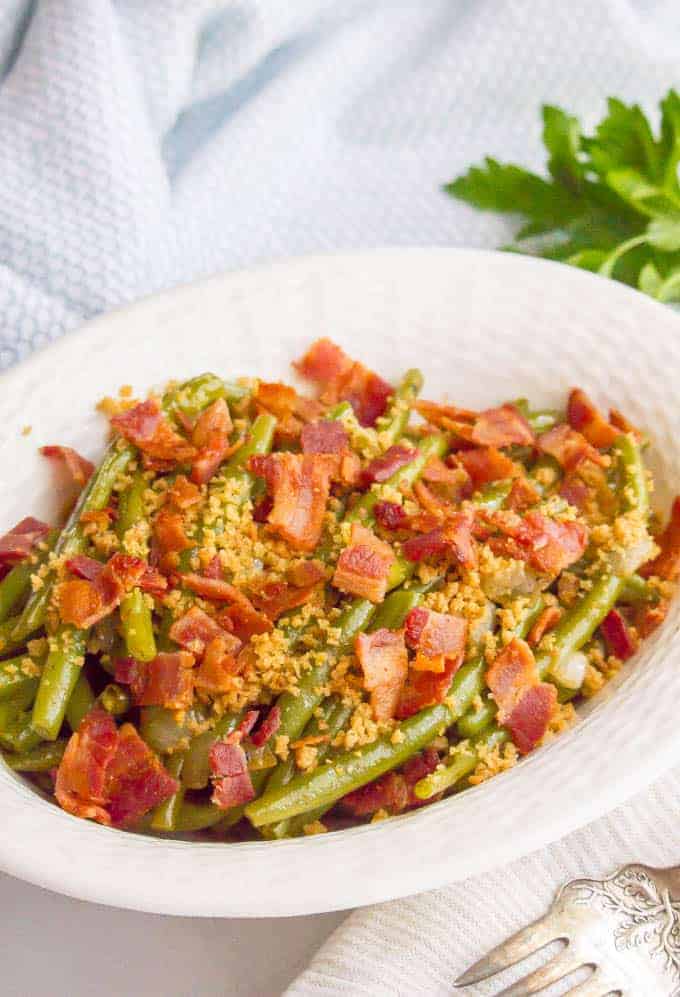 Green beans with bacon and buttery breadcrumbs are just 5 ingredients but packed with so much flavor for a delicious, easy side dish! #greenbeans #sidedish #veggies #veggieside