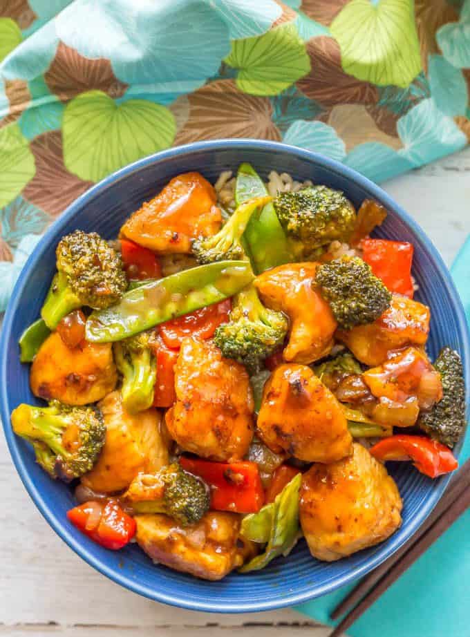 Healthy, easy sweet and sour chicken with vegetables served in a blue bowl