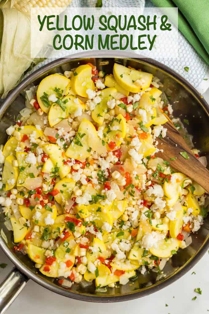 A large deep skillet with yellow squash and corn mixed together.