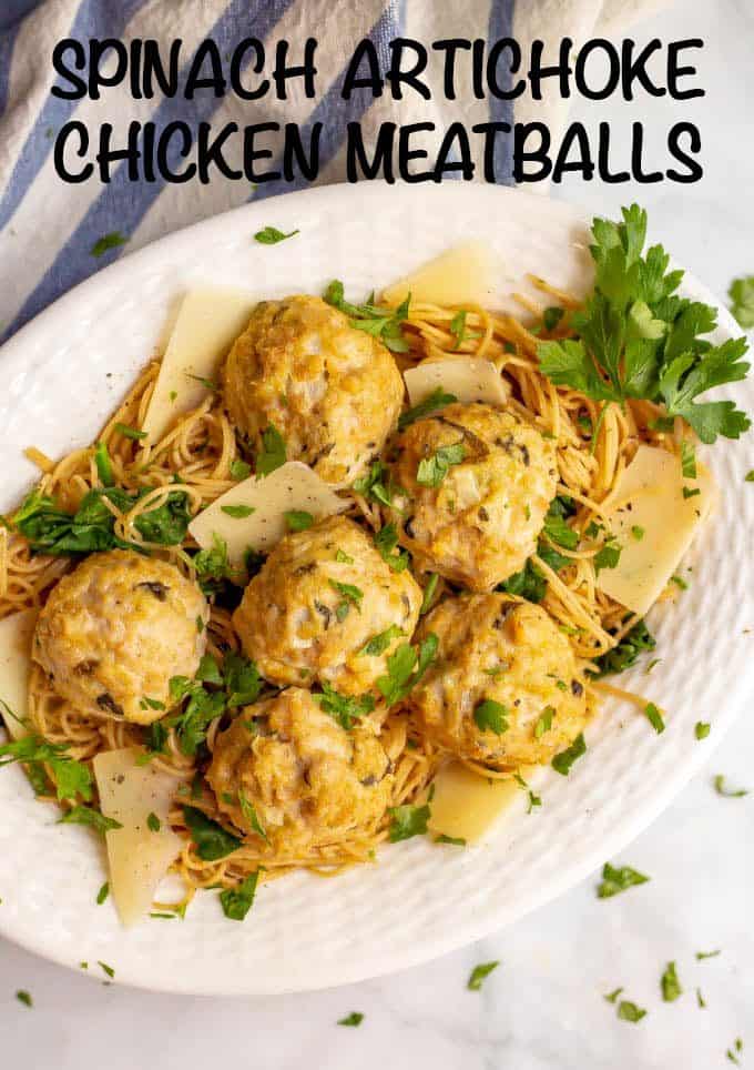 Spinach artichoke chicken meatballs are a really quick and easy dinner recipe with big flavor and just 7 ingredients! They go great with pasta or can be used as an appetizer. #chicken #meatballs #easydinner