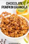 Close up of a bowl of homemade chocolate granola with a text overlay on it.