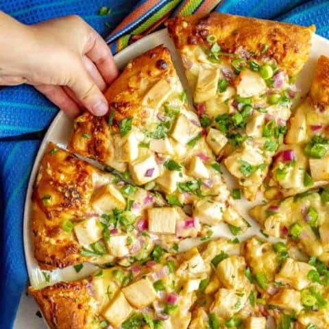 Easy BBQ chicken pizza comes together so quickly with just a few store-bought ingredients and is packed with tons of flavor! It’s perfect for a different twist on pizza night! #bbqchicken #pizza #dinner