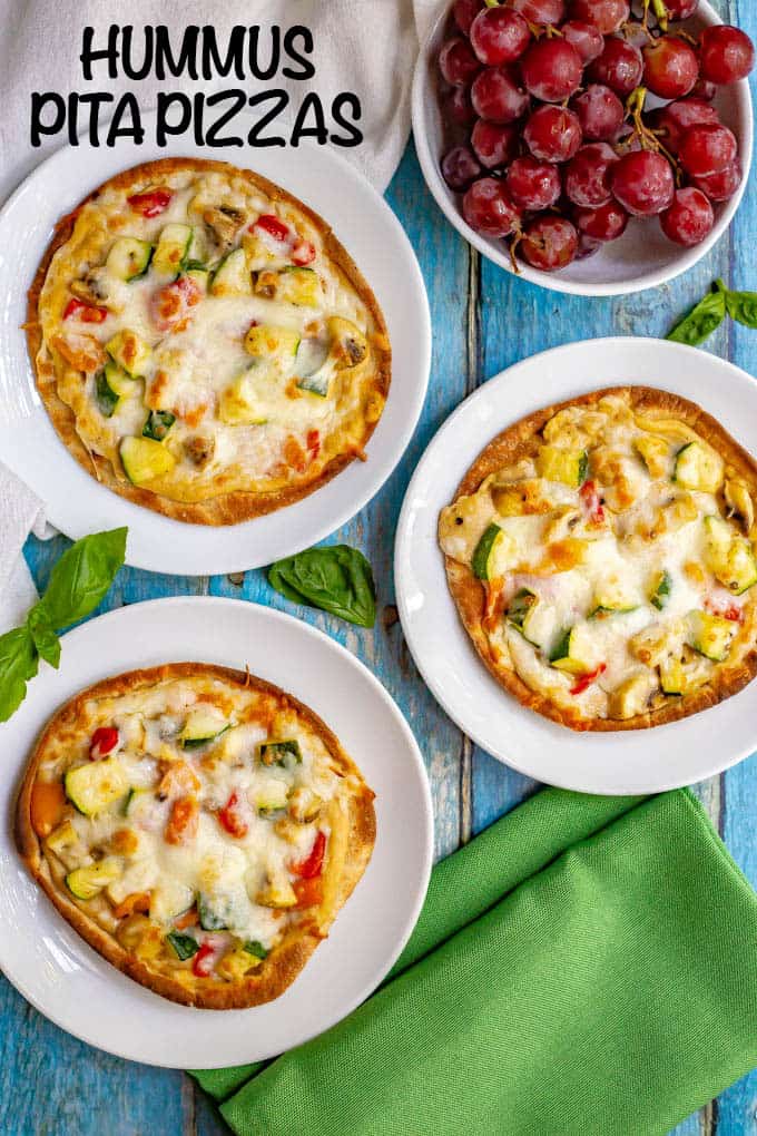 Hummus pita pizza with veggies takes just a few minutes to make and is great served warm or cold. Customize with your favorite hummus flavor and veggie toppings and enjoy for lunch, a snack or a light dinner! #hummus #pizza #healthyrecipes