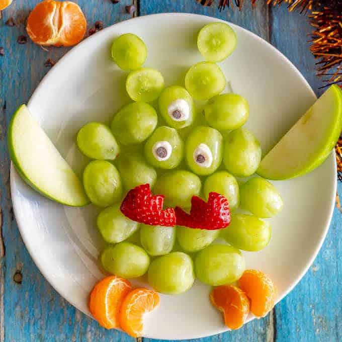 Easy green monster fruit snack plate with grapes, apples and oranges