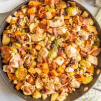 One-pot easy harvest chicken skillet with sweet potatoes and Brussels sprouts is a beautiful and delicious recipe that’s perfect for a fall dinner!
