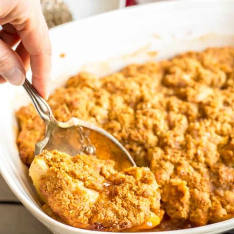 This healthy apple cobbler is full of apple and cinnamon flavors and goes perfect with ice cream for a delicious dessert. It’s naturally sweetened and made with whole grains for a healthier sweet treat that will surely satisfy. #apples #cobbler #dessert #baking