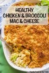A spoon in a baking dish scooping up a serving of chicken and broccoli mac and cheese casserole.