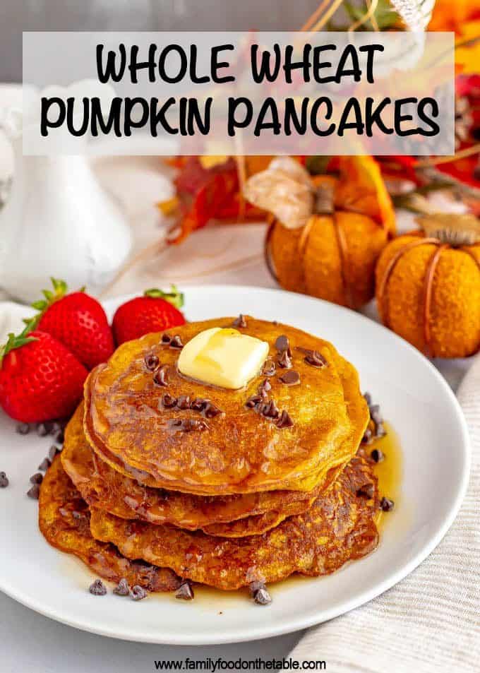 Whole wheat pumpkin pancakes are light, fluffy and full of warm spices and pumpkin flavor. They are naturally sweetened (and can be made vegan) and are perfect for a delicious fall breakfast! #pumpkin #pancakes #breakfast #vegan