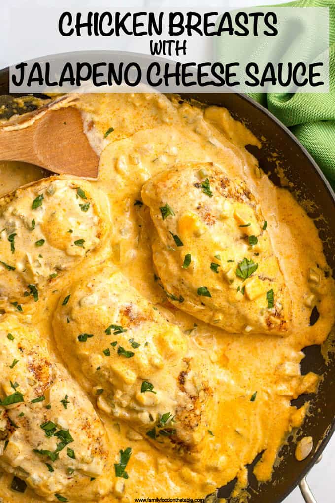 Skillet seared chicken breasts are covered in a jalapeño cheddar sauce for an easy, flavorful dinner that’s great for a weeknight or for company! Serve with rice or quinoa to soak up that delicious creamy sauce! #chickenrecipe #chickendinner #jalapenos #cheesy