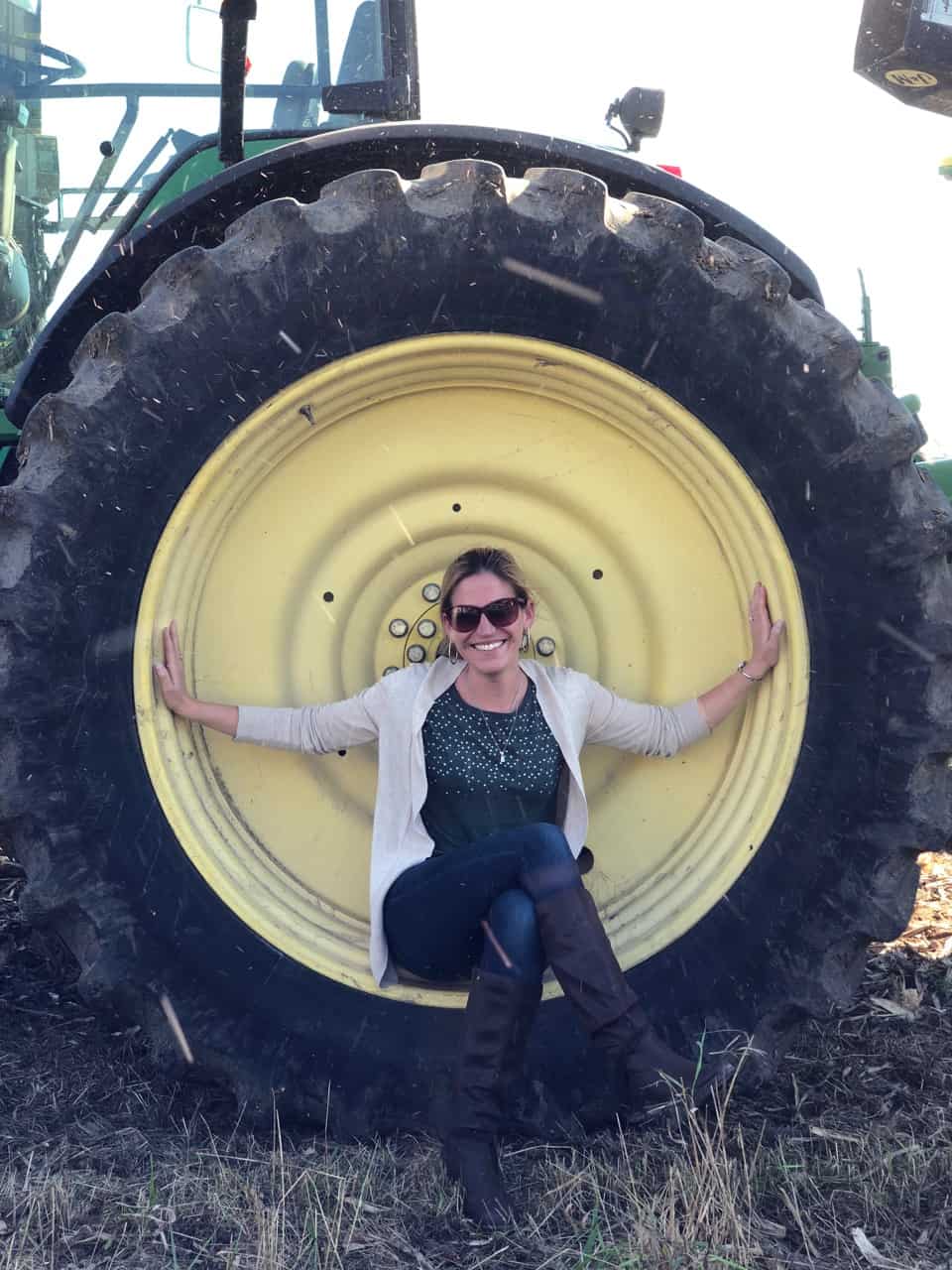 Woman posing in a tractor tire